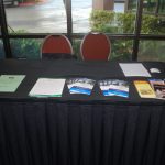 NFB Exhibit Table showing brochures laying atop a black tablecloth