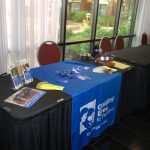 Guiding Eyes Exhibitor Table with marketing material displayed